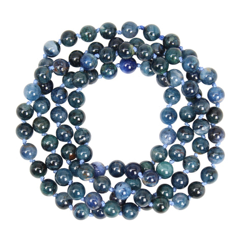 Blue jade beaded necklace showing natural variations in deep blue, teal green and soft blue gemstone colors