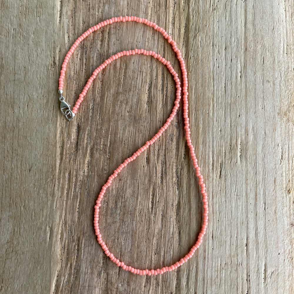 
                      
                        Salmon Pink Seed Bead Necklace
                      
                    