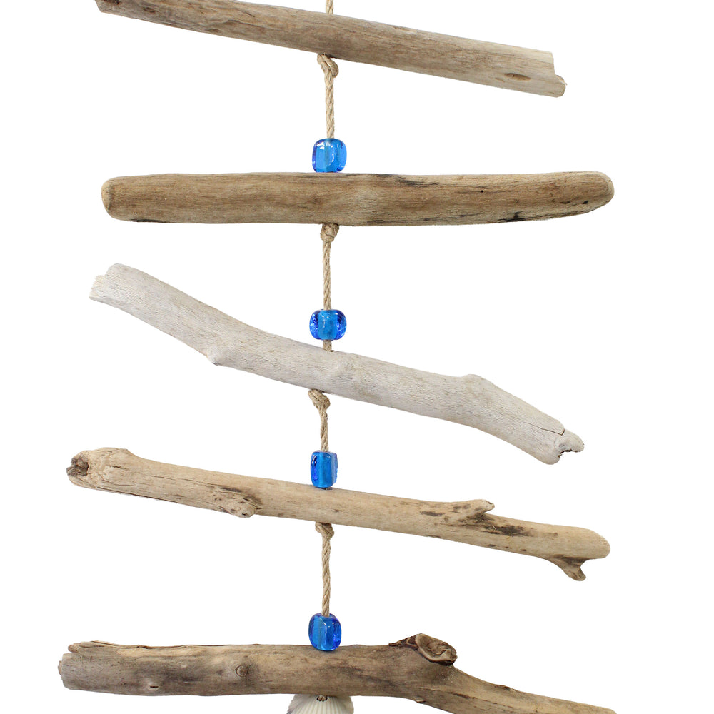 
                      
                        Decorative hanging with driftwood pieces and a shell 
                      
                    