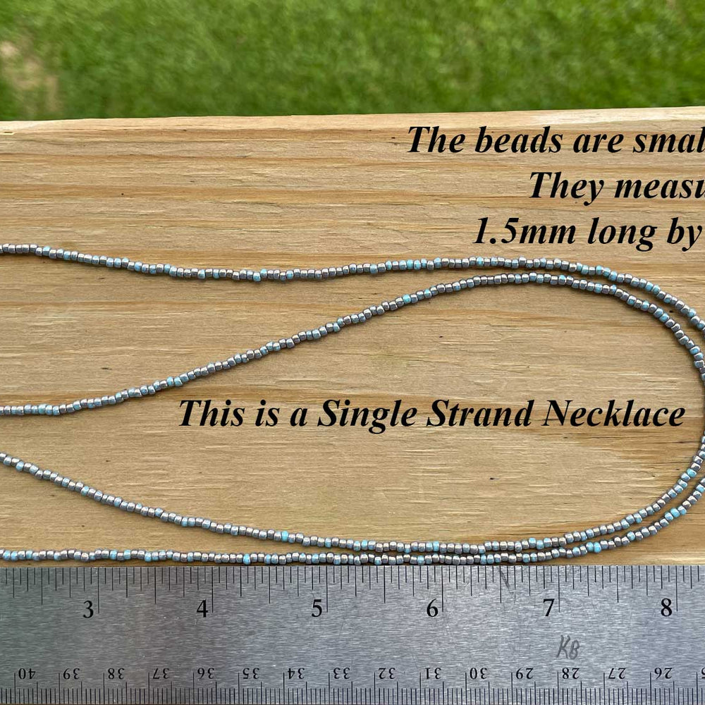 
                      
                        Gilded Marble Turquoise Seed Bead Necklace
                      
                    