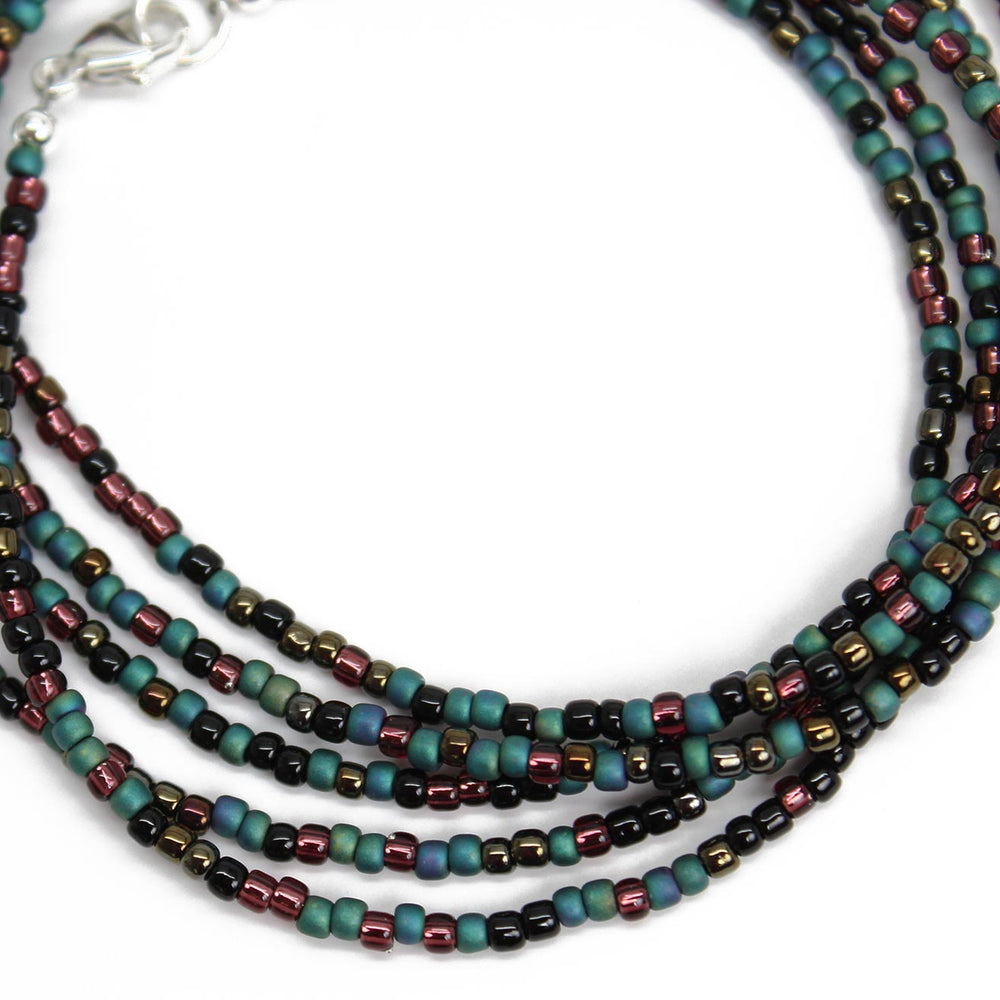 
                      
                        Mixed Teal Green Black and Plum Seed Bead Necklace
                      
                    