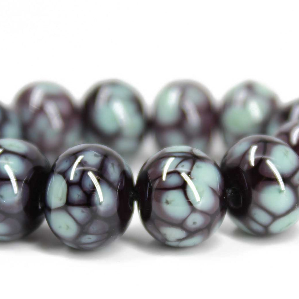 
                      
                        Turquoise and Plum Lampwork Beads
                      
                    