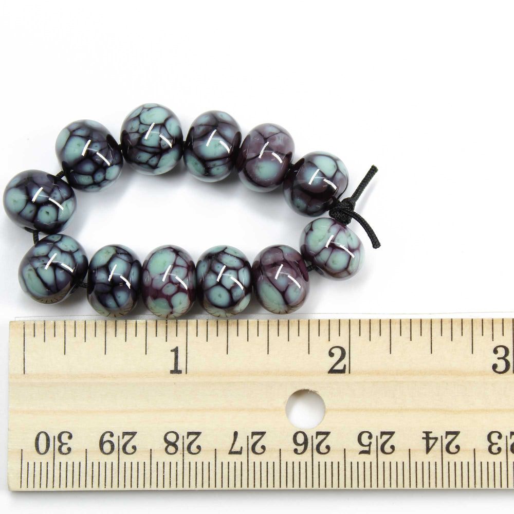 
                      
                        Turquoise and Plum Lampwork Beads
                      
                    