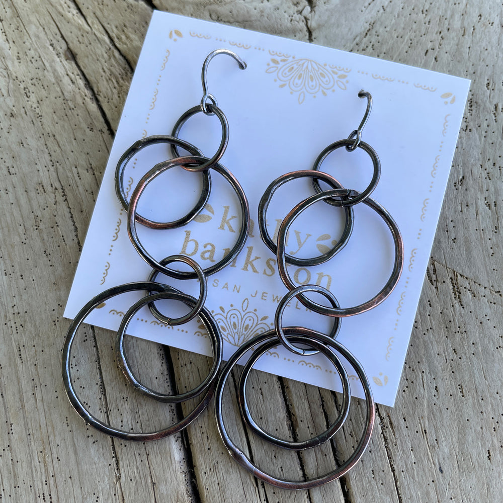 
                      
                        Long Copper Hoop Earrings with Sterling Silver Ear Wires by Kathy Bankston
                      
                    