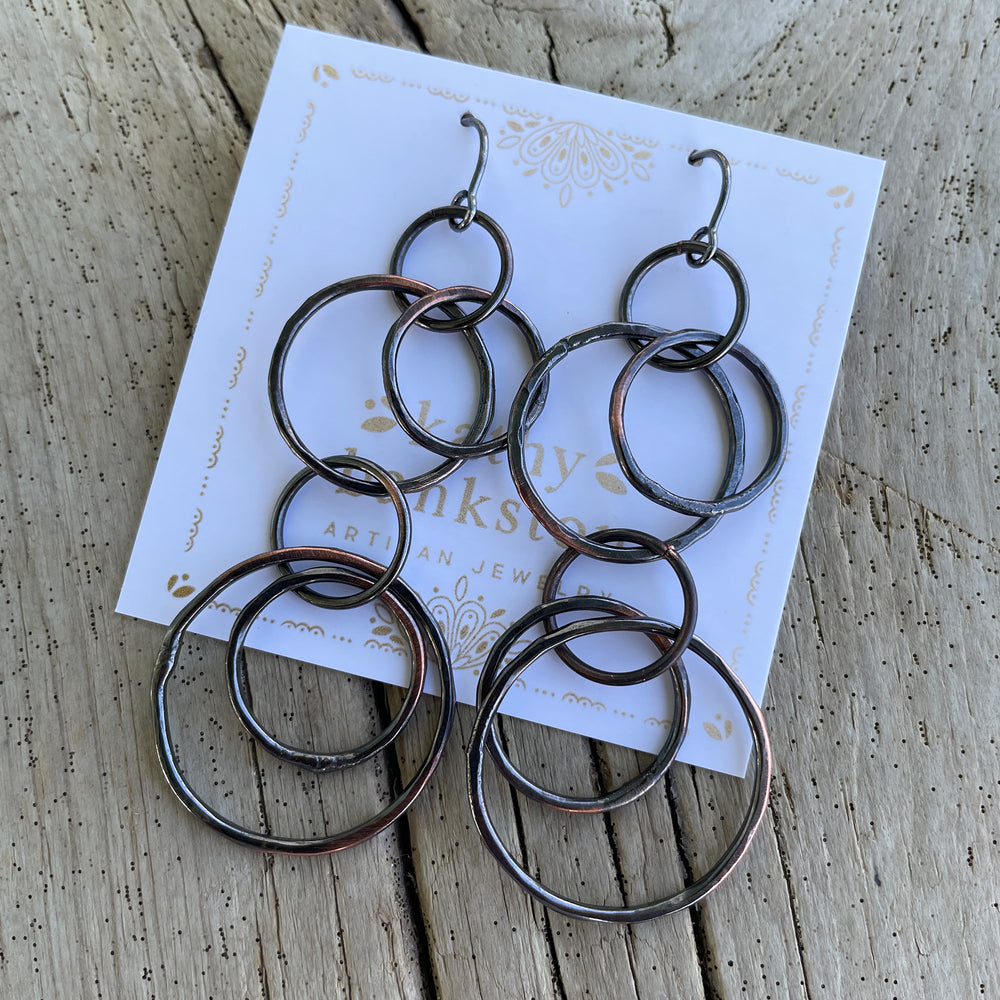 
                      
                        Long Copper Hoop Earrings with Sterling Silver Ear Wires by Kathy Bankston
                      
                    