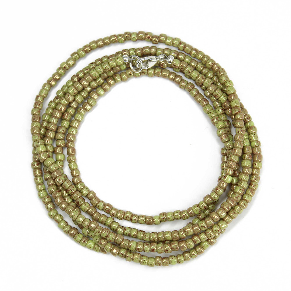 
                      
                        Marbled Opaque Avocado Seed Bead Necklace
                      
                    