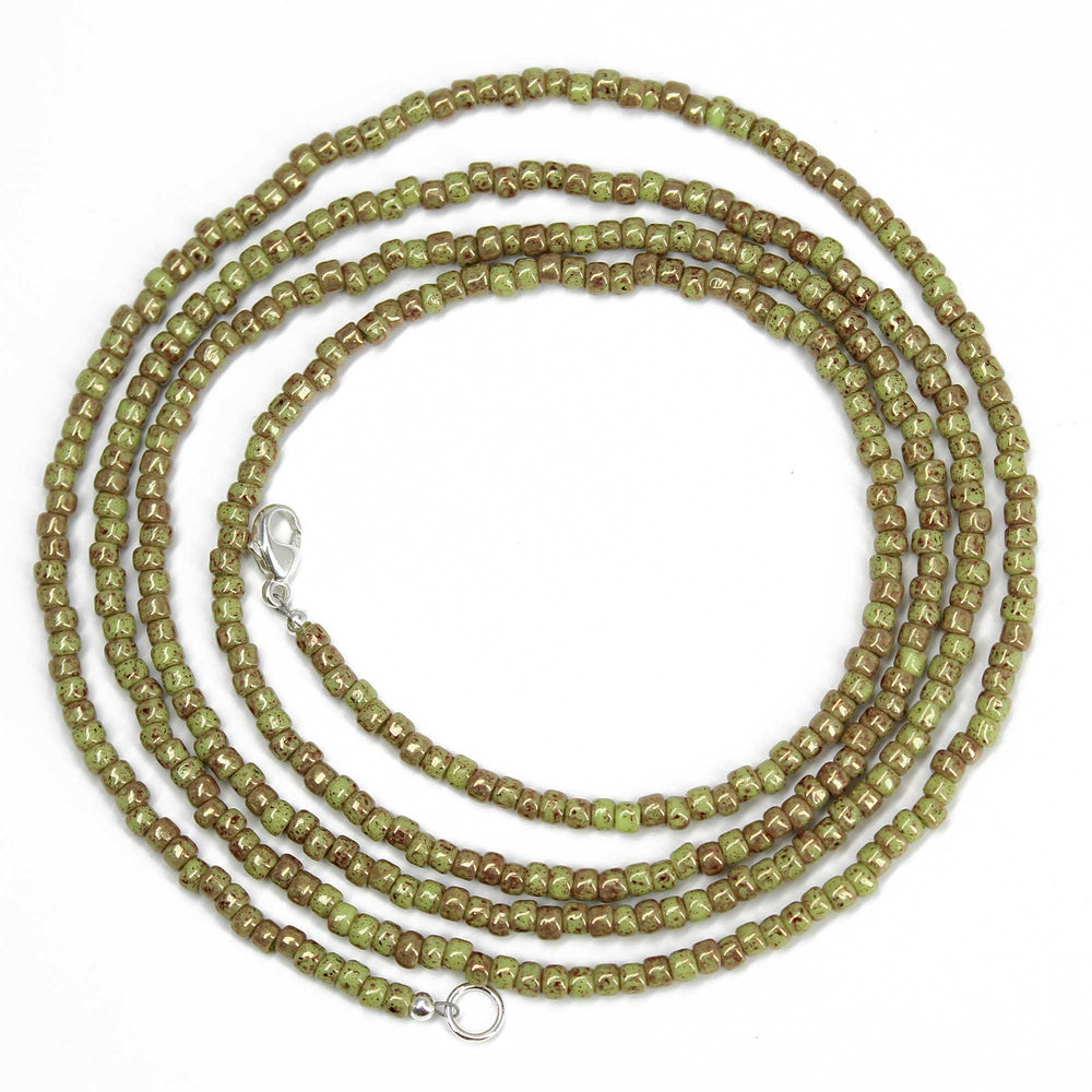 
                      
                        Marbled Opaque Avocado Seed Bead Necklace
                      
                    