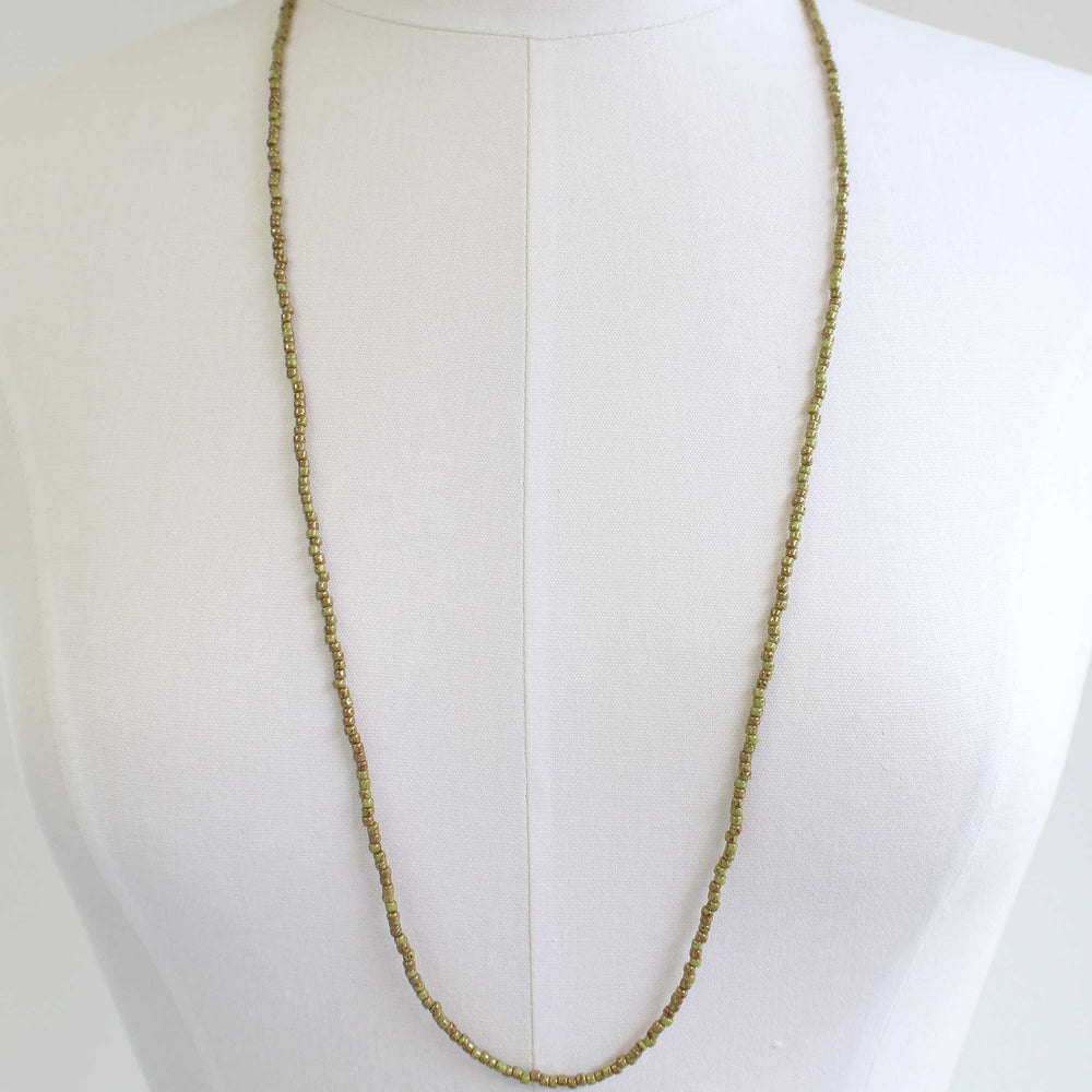 
                      
                        Marbled Opaque Avocado Seed Bead Necklace
                      
                    