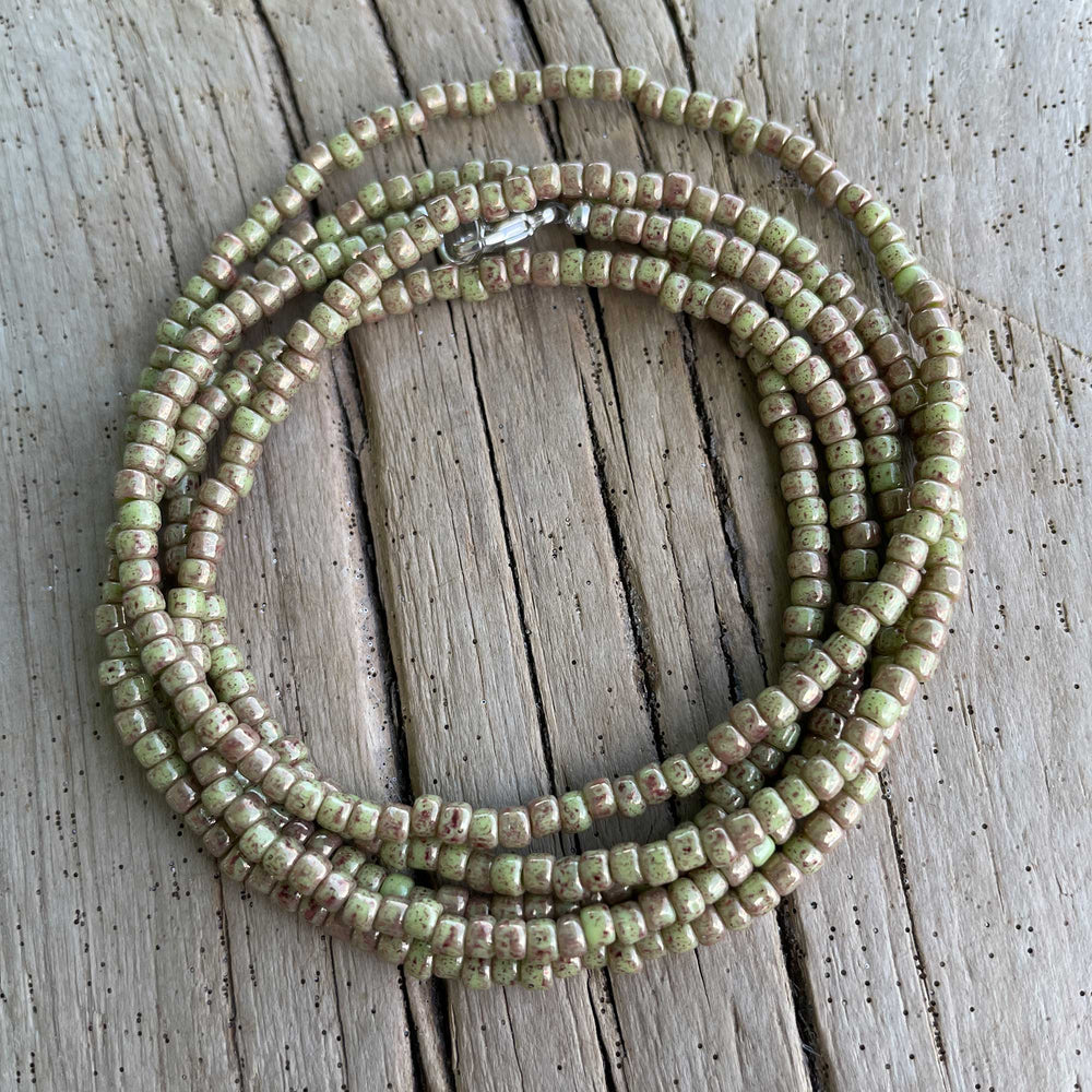 
                      
                        Marbled Opaque Avocado Seed Bead Necklace
                      
                    