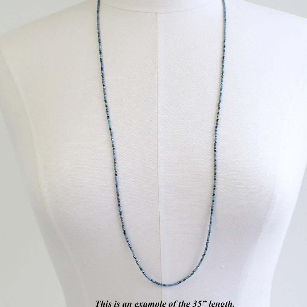 
                      
                        Mixed Blue Seed Bead Necklace
                      
                    