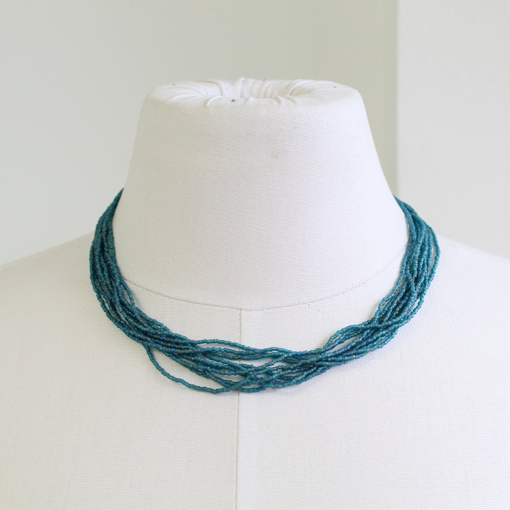 
                      
                        Multi Strand Teal Seed Bead Necklace 18 Inches
                      
                    