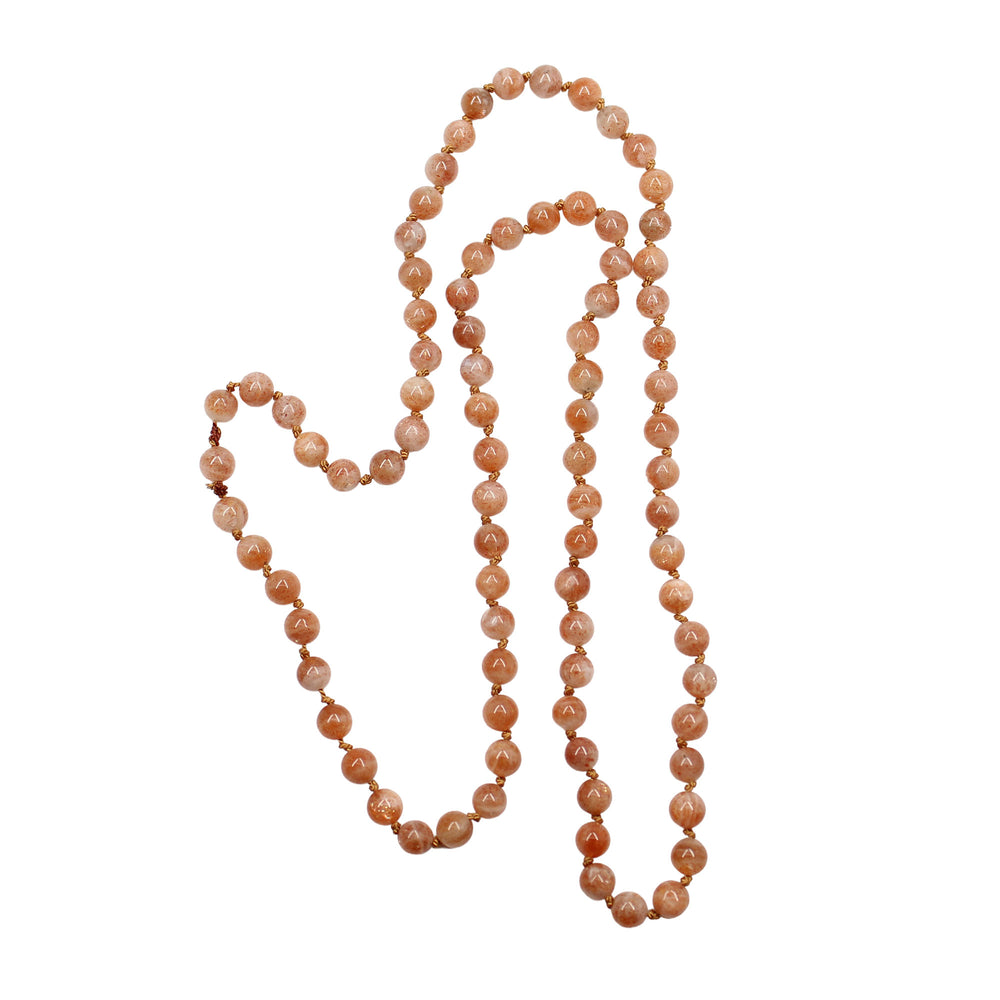 
                      
                        Long string of peach-colored sunstone beads 
                      
                    