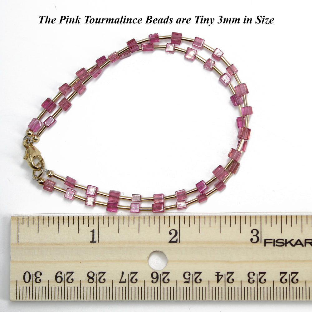 
                      
                        Pink Tourmaline Cube Bead Bracelet with Yellow Gold Filled Accents
                      
                    