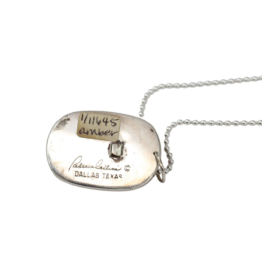 
                      
                        Backside of Amber Pendant with Chain
                      
                    