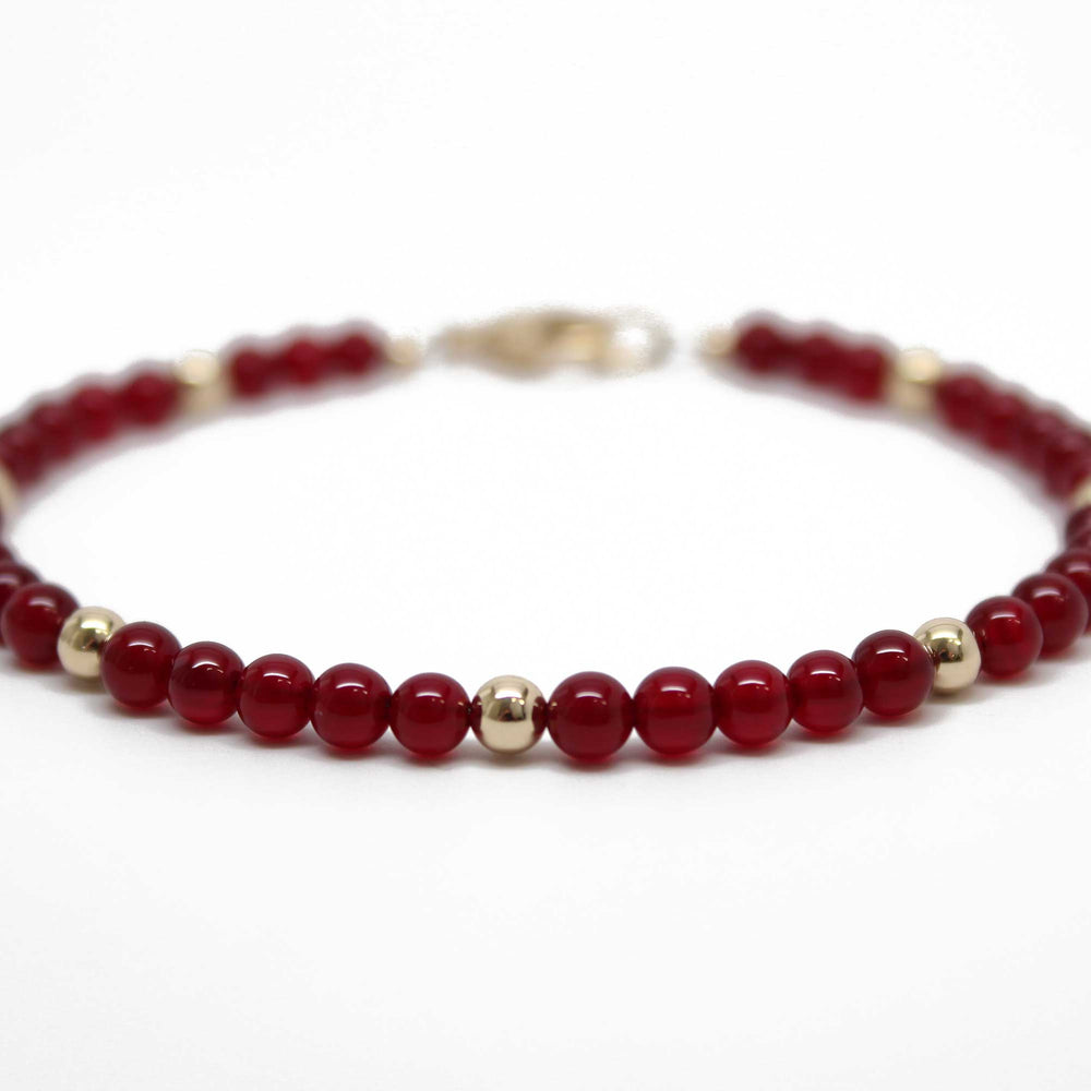 
                      
                        Red Jade and Gold Filled Bead Bracelet
                      
                    