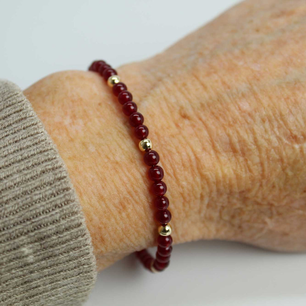 
                      
                        Red Jade and Gold Filled Bead Bracelet
                      
                    