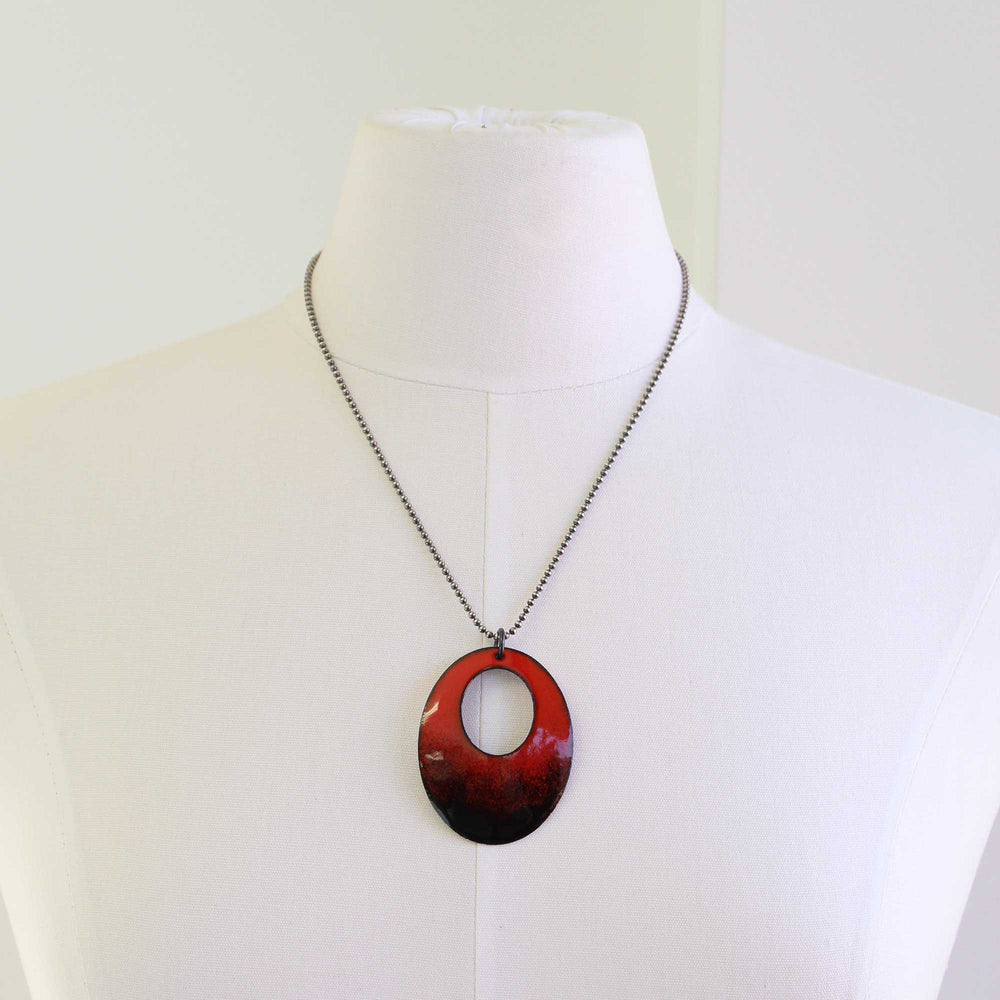 
                      
                        Red and Black Glass Enamel Oval Pendant Necklace
                      
                    