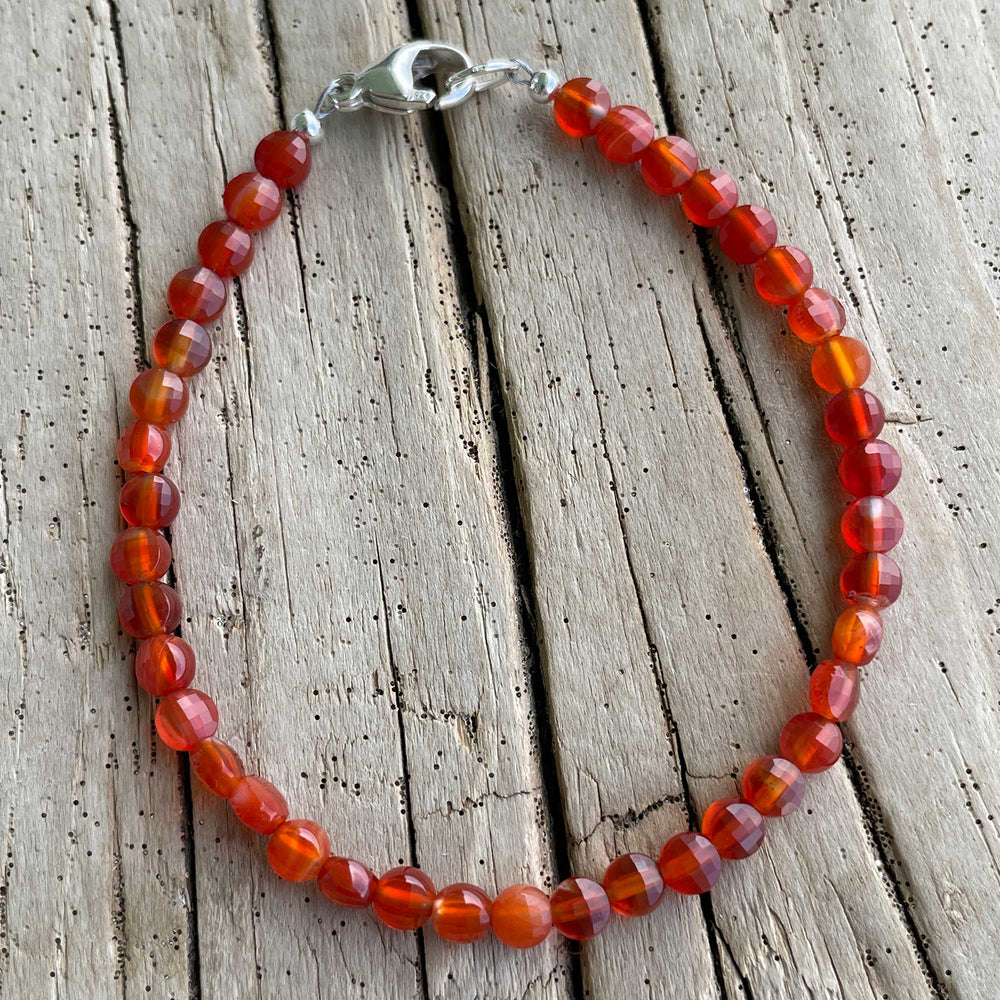 
                      
                        Faceted Red Carnelian Coin Bracelet
                      
                    