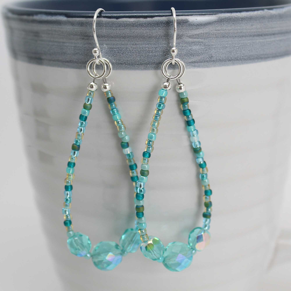 
                      
                        Blue Green Seed Bead Earrings with Czech Crystal Accents
                      
                    