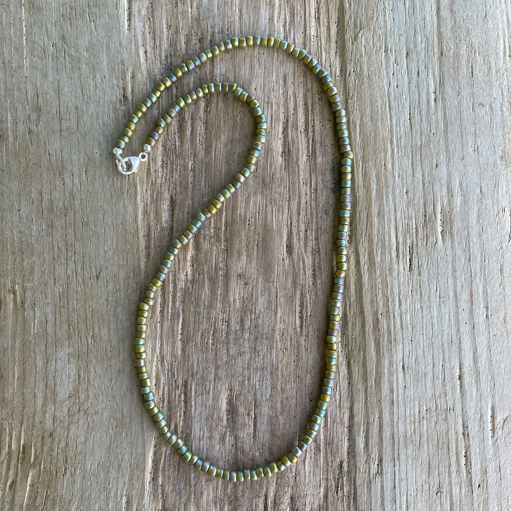 
                      
                        Semi Glazed Olive Green Seed Bead Necklace
                      
                    