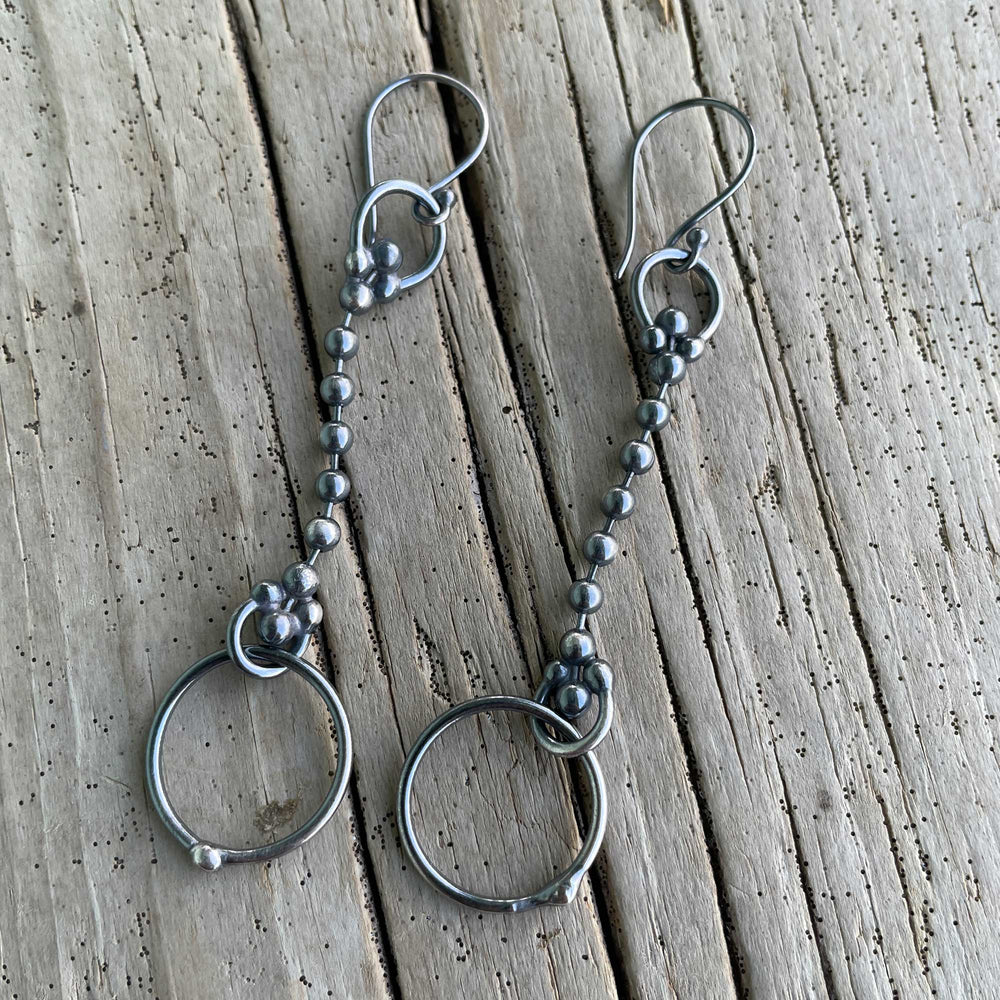 
                      
                        Pair of silver beaded earrings
                      
                    