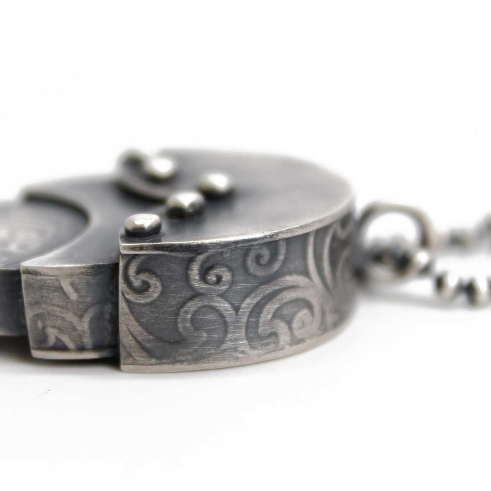 
                      
                        Embossed Sterling Silver Nested Pendant 
                      
                    