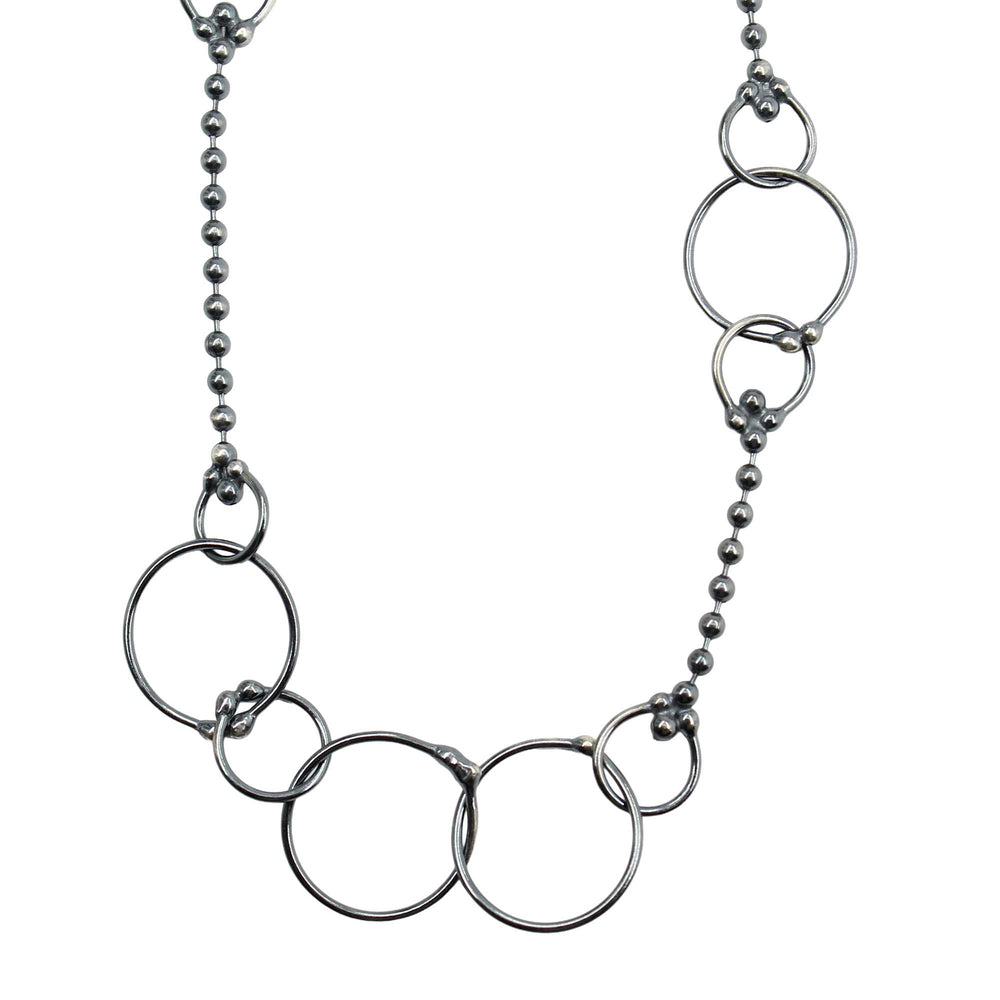 
                      
                        Silver necklace with interlocking rings 
                      
                    