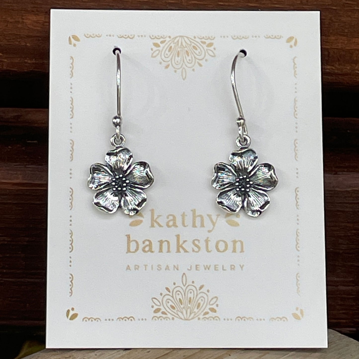 Cherry blossom earrings displayed on a white Kathy Bankston Artisan Jewelry branded earring card.