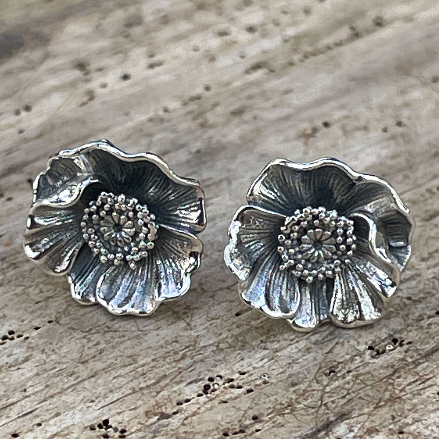 Poppy Stud Earrings on Wood Background
