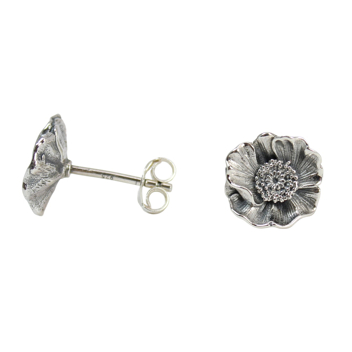 Pair of handcrafted sterling silver poppy stud earrings displayed together to show the realistic floral texture and botanical design.