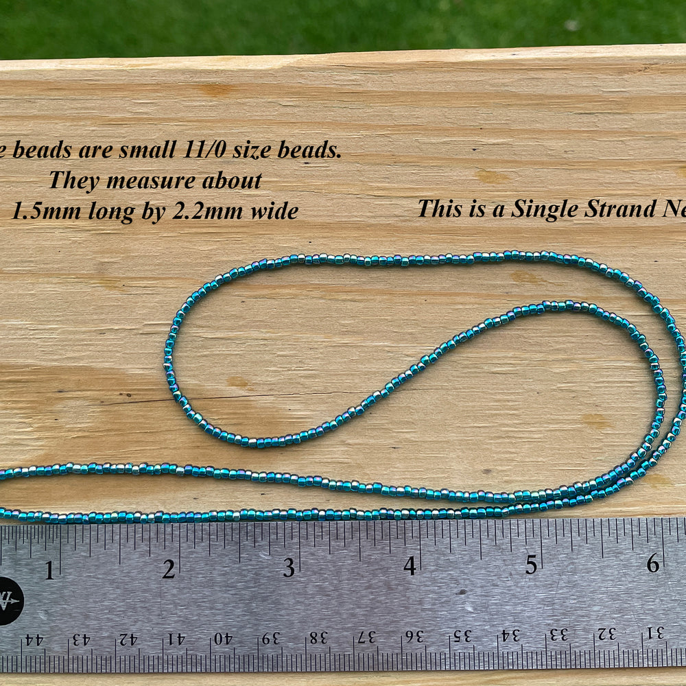 
                      
                        Transparent Rainbow Teal Seed Bead Necklace
                      
                    