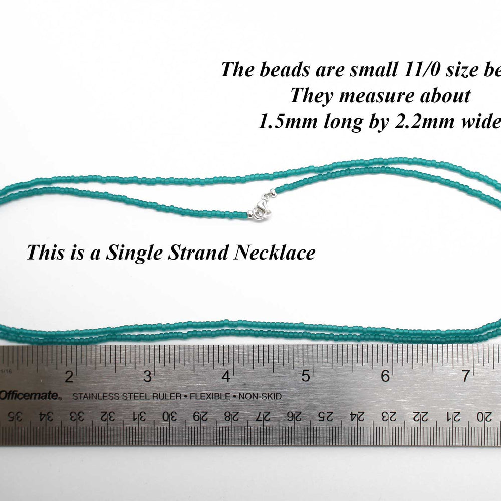 
                      
                        Transparent Teal Matte Seed Bead Necklace
                      
                    