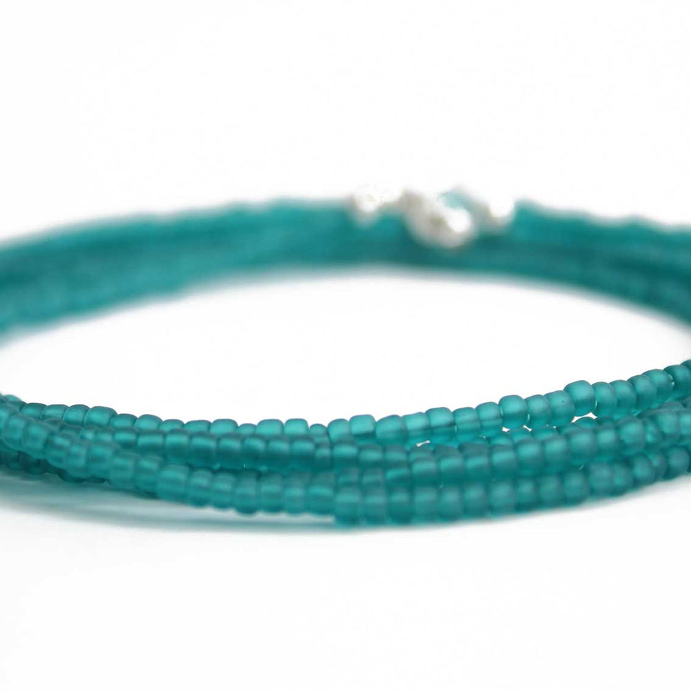 
                      
                        Transparent Teal Matte Seed Bead Necklace
                      
                    