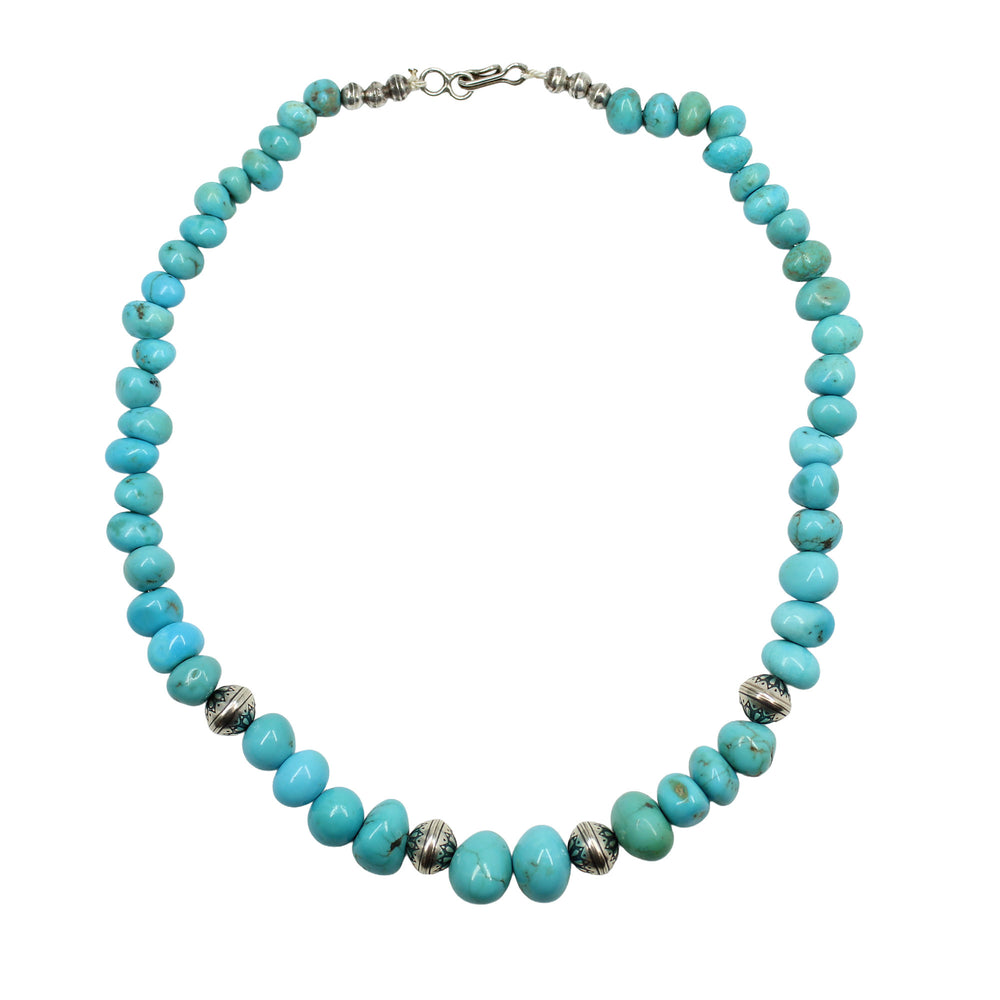 
                      
                        Turquoise beaded necklace with silver accents
                      
                    