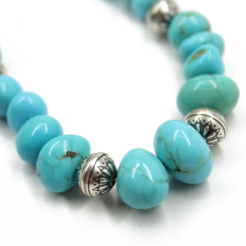 
                      
                        Turquoise beaded necklace with silver accents 
                      
                    