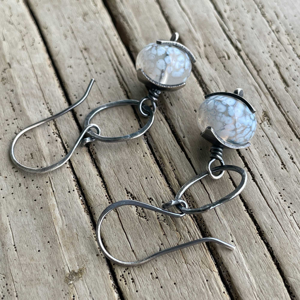 
                      
                        White beaded earrings
                      
                    