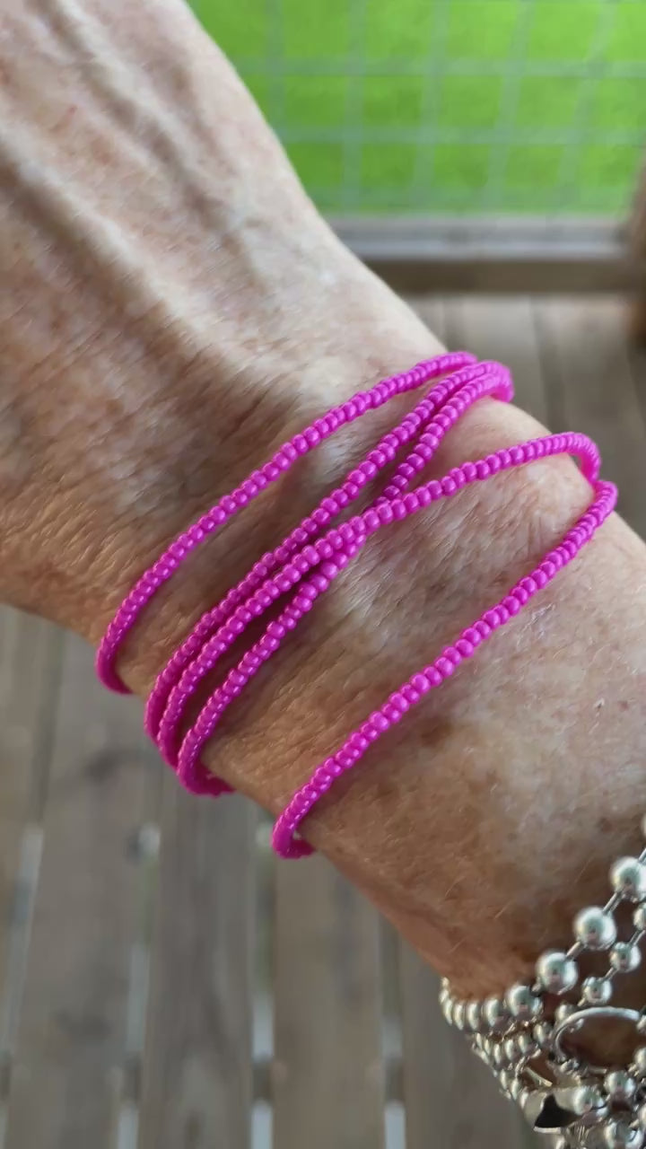 magenta pink seed bead necklace wrapped as a bracelet