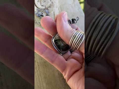 
                      
                        Load and play video in Gallery viewer, Picasso Ammonite Fossil Necklace in Sterling Silver with Secret Message
                      
                    