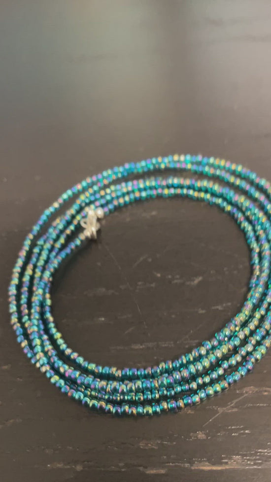 Load and play video in Gallery viewer, Transparent Rainbow Teal Seed Bead Necklace, Thin 1.5mm Single Strand
