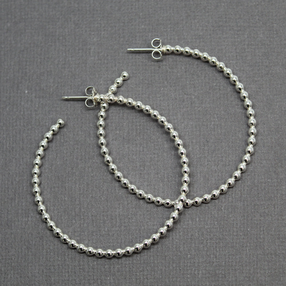 
                      
                        Sterling Silver Ball Wire Hoop Earrings
                      
                    