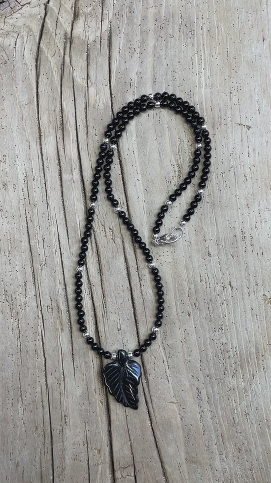 Load and play video in Gallery viewer, Black Onyx Necklace with Hand Carved Onyx Leaf
