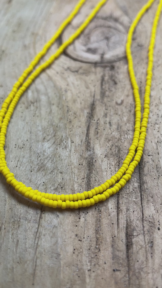 Load and play video in Gallery viewer, Canary Yellow Seed Bead Necklace, Thin 1.5mm Single Strand Beaded Necklace
