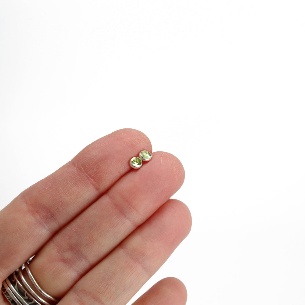 
                      
                        Peridot Stud Earrings in Sterling Silver 4mm
                      
                    