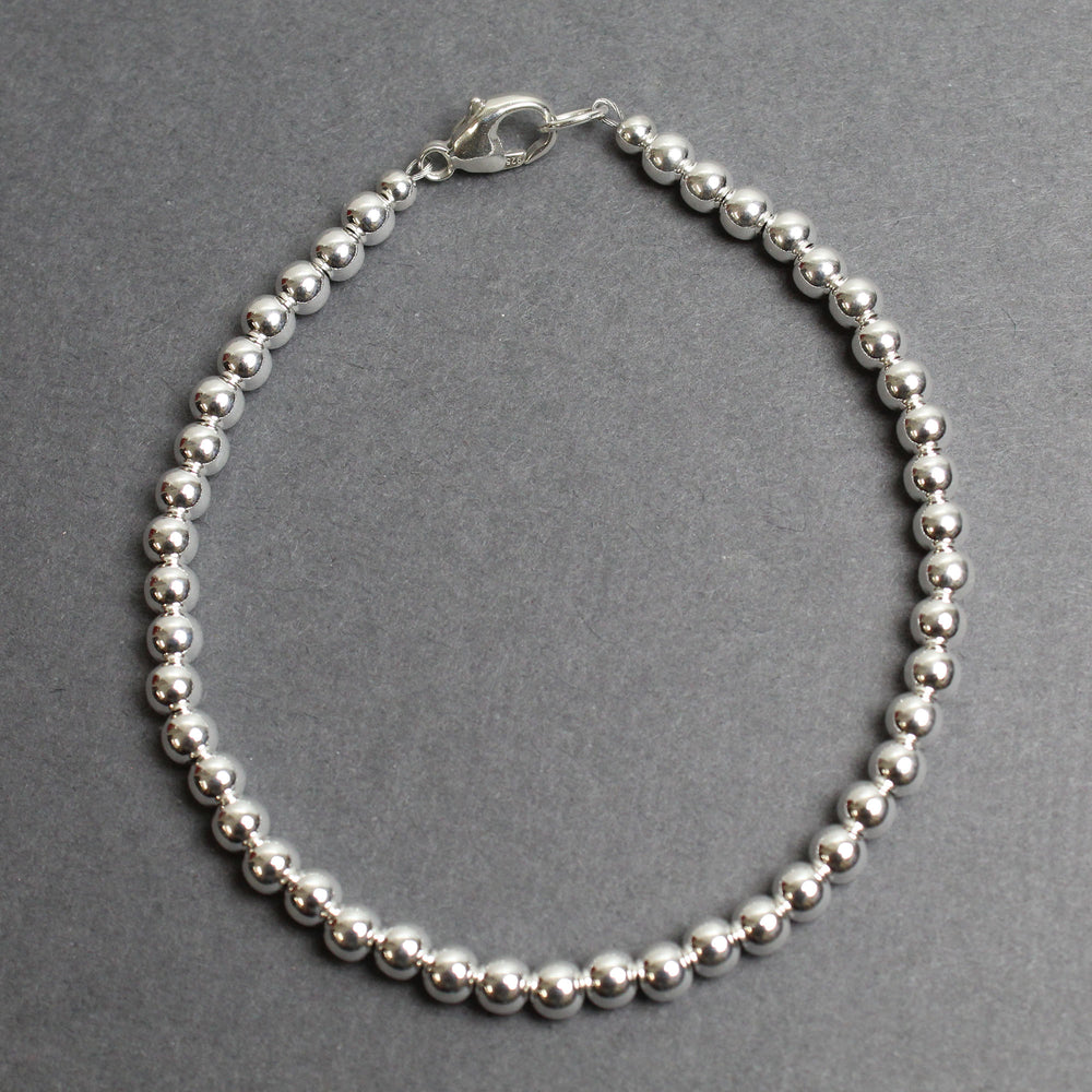 
                      
                        4mm Sterling Silver Bead Bracelet
                      
                    