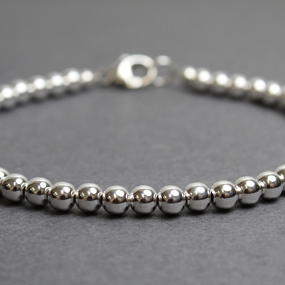 
                      
                        4mm Sterling Silver Bead Bracelet
                      
                    