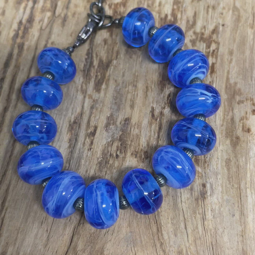 
                      
                        Load and play video in Gallery viewer, Handmade Blue Lampwork Bead Bracelet with Turtle Charm
                      
                    