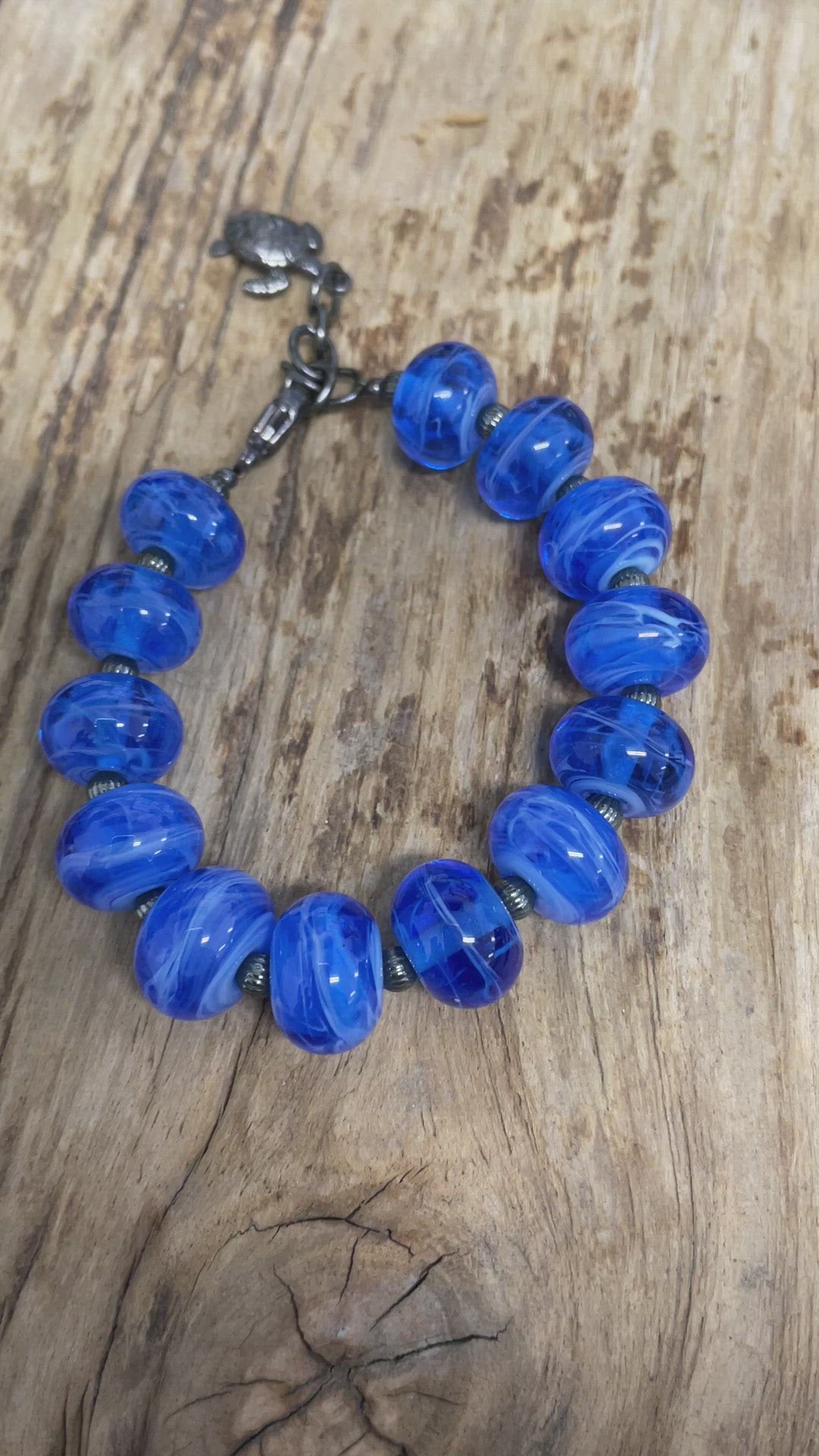 Load and play video in Gallery viewer, Handmade Blue Lampwork Bead Bracelet with Turtle Charm
