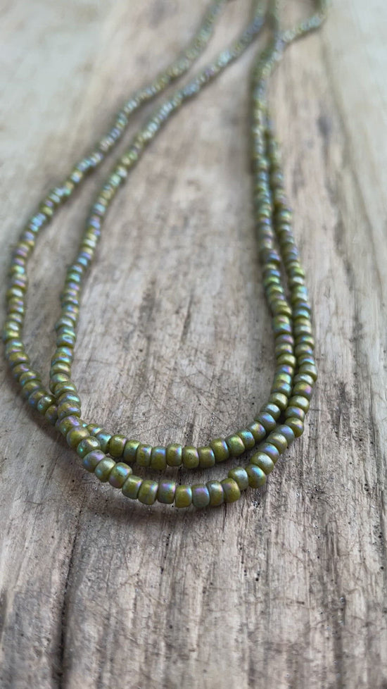 Load and play video in Gallery viewer, Semi Glazed Olive Green Seed Bead Necklace, Thin 2mm Single Strand Green Beaded Necklace

