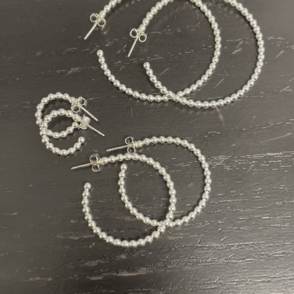 
                      
                        Load and play video in Gallery viewer, Sterling Silver Ball Wire Hoop Earrings
                      
                    