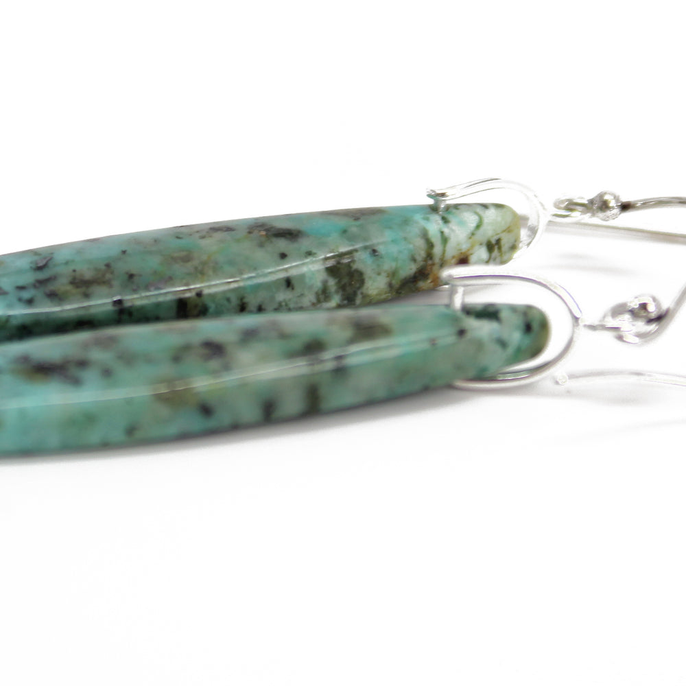 
                      
                        African Turquoise Slab Dangle Earrings
                      
                    